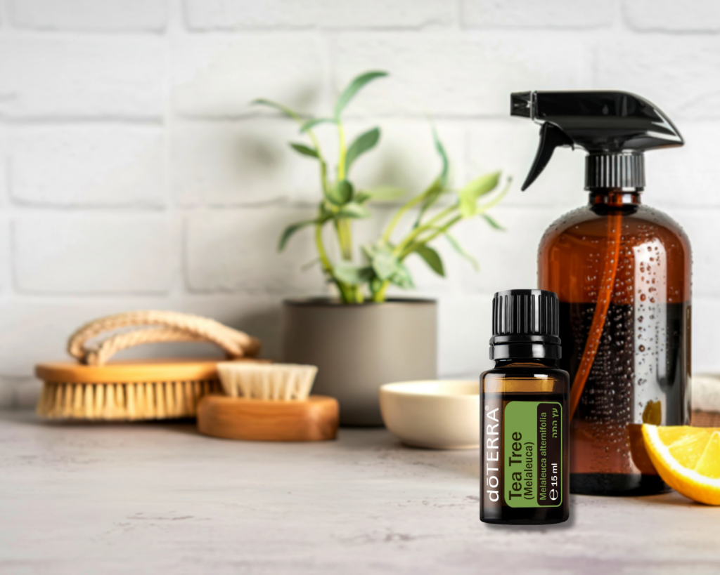Zestaw do naturalnego sprzątania: olejek Tea Tree dōTERRA obok butelki z atomizerem